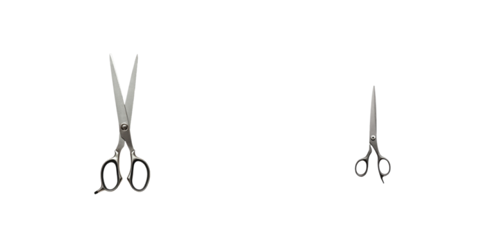 Two pairs of scissors displayed on a solid transparent background, one large and one small, showcasing their metallic finish and design details, isolated with no other objects present
