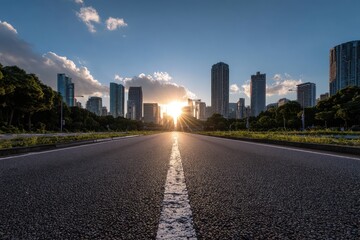 Road leading to city skyline with sun shining through buildings and cloudy skies