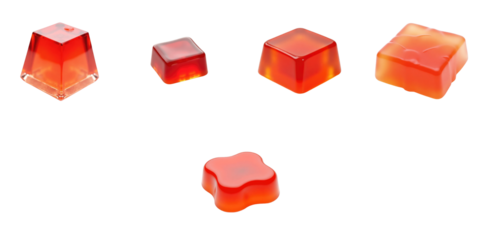 assorted jelly candies in various square and flower shapes displaying a translucent texture and vibrant orange to red colors arranged on a transparent background