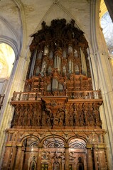 Seville, Spain 03.24.2019: Pipe organ inside the Seville Cathedral and La Giralda