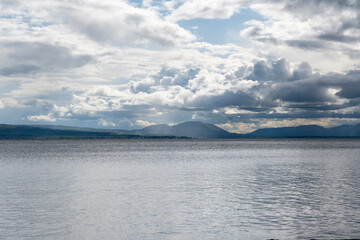 Dramatic Clouds Over a Calm Mountain Lake