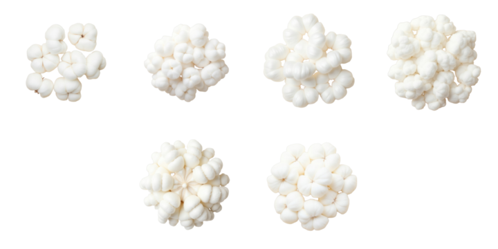 Collection of fluffy white cotton wool balls arranged on a transparent background displaying various sizes and shapes, eco-friendly material for hygiene and health applications.