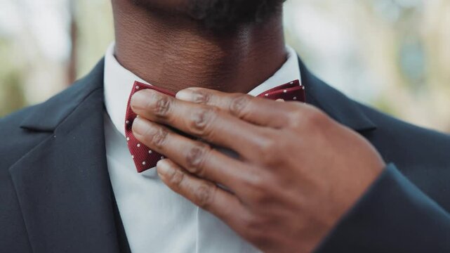 businessman adjusting his tie