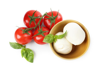 Tasty mozzarella cheese balls, tomatoes and basil on white background, top view