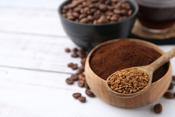 Different types of instant coffee and beans on white wooden table, closeup. Space for text