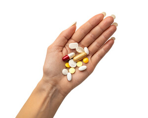 A human hand holds various pills and capsules. The hand has long, manicured nails. The background is transparent, emphasizing the hand and medication.