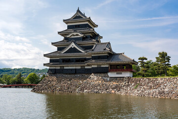Naklejka premium Beautiful of the evening light cast upon Matsumoto Castle, also known as the Crow Castle is landmark and beloved tourist destination in Matsumoto City, Nagano Prefecture, Japan.
