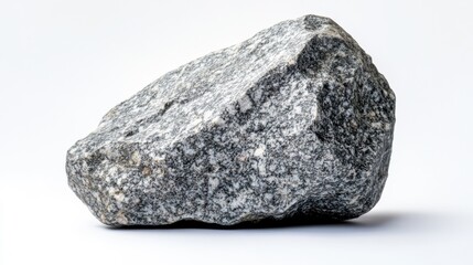 A Rough Grey Granite Stone Isolated on White Background Showing its Natural Texture and Irregular Shape Ideal for Construction or Landscaping Projects © Pixels 