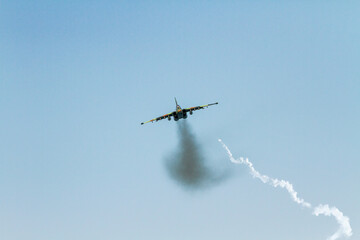 A military plane tries to avoid being hit by a missile.
