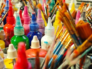Obraz premium Bottle of water colors and paint brushes. 