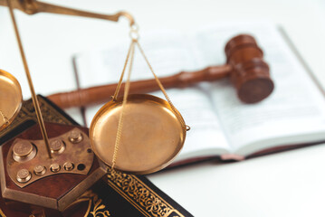 Weight scale and wooden gavel in background