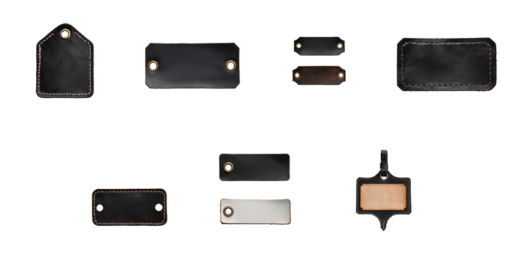Various styles of transparent and brown leather labels and tags with stitching and eyelets arranged on a transparent background, suitable for customization and branding purposes.