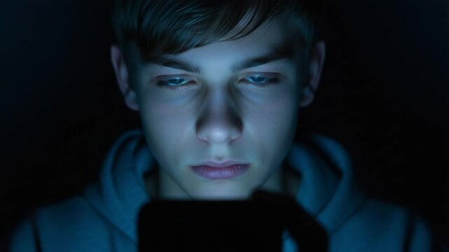 Cyber Bullying in the Dark Showing Teen Boy Facing Online Harassment from Digital Devices