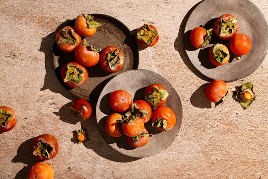 fresh persimmon in hard light