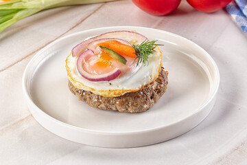 Beefsteak chop with roasted egg