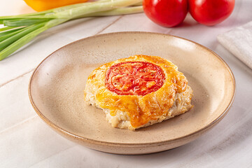 Chicken chop cutlet with cheese and tomato