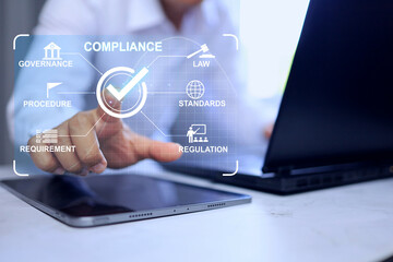 Compliance concept with businessman working on laptop screen to submit requirement or standard and law for export and import the products