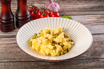 Scrambled egg omelet with green peas