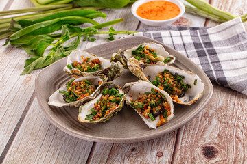 Gournet grilled oysters with onion and peanut