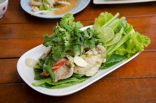Boiled Pork with Lime Garlic and chili and lemon spicy sweet sauce thai called Moo Ma nao