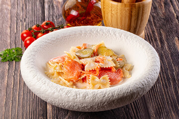Italian pasta farfalle with salmon