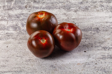 Raw juicy sweet tomato Kumato