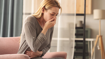 Young woman feeling nauseated