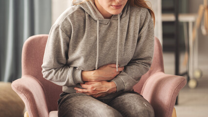 Young woman with stomach ache