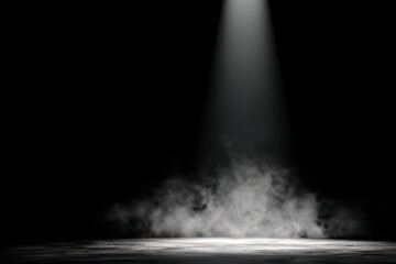 Spotlight beam illuminates stage with smoke and dark atmosphere, anticipating performance or event.