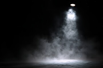 Dramatic stage spotlight creates ethereal atmosphere with swirling fog and shadows for theatrical performances.