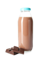 Tasty chocolate milk in glass bottle and pieces isolated on white