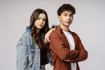 Young students posing with crossed arms and confident expression