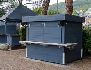 Closed wooden material kiosk inside public park