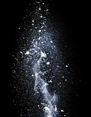 Obraz premium White Powder Explosion on Black Background