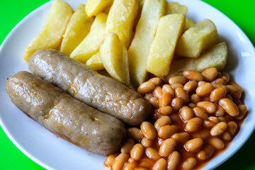 British Favourite Pork Sausages With Chips And Baked Beans In Tomato Sauce