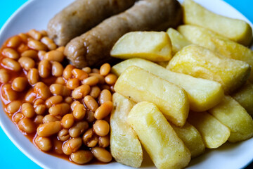 British Favourite Pork Sausages With Chips And Baked Beans In Tomato Sauce