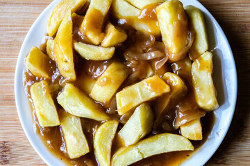 Plate of Wholesome Chips With Onion Gravy