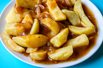 Plate of Wholesome Chips With Onion Gravy