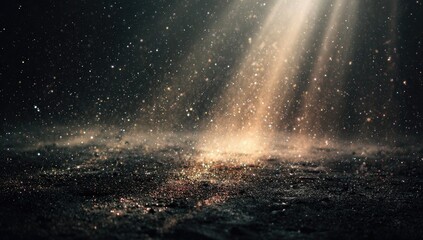 A dark, textured surface illuminated by a bright beam of light, filled with swirling dust and glittering particles