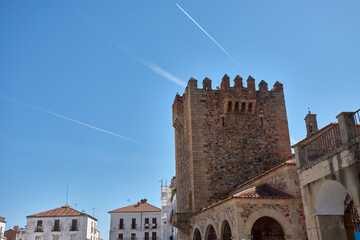 Bujaco Tower in Caceres under a clear blue sky