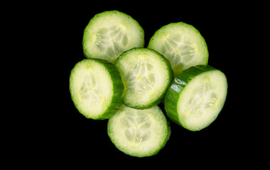 Fresh and tasty cucumber isolated on black background