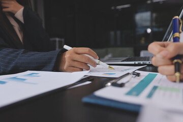 Team of business people working together in the meeting room office,
teamwork background charts and graphs banner, double exposure successful teamwork,business planning concept.