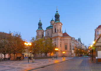 St Nicholas Church in Prague Czech Republic captured at dawn with surrounding buildings