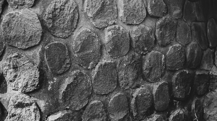 Arrangement of round stones on concrete in close proximity, home garden decoration. as a natural...