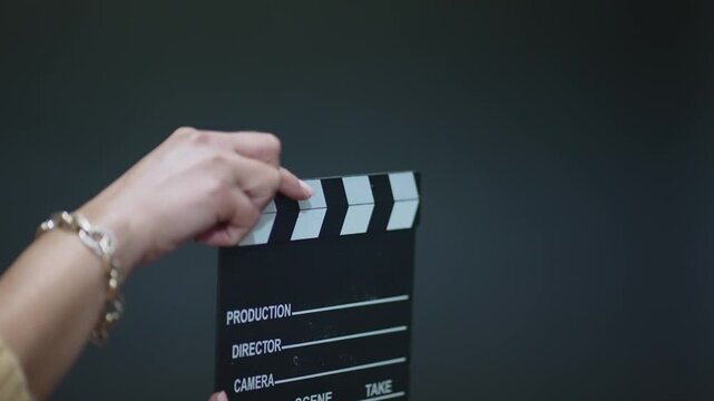 Close-up of a film clapperboard held during a video production shoot