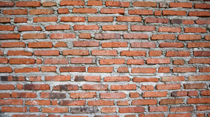 A detailed texture of handmade terracotta bricks with natural color variations. The earthy tones...