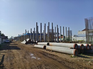 the line of pile foundations for the elevated toll road project. spun pile concrete foundation...