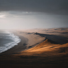 Aerial view of a coastline with waves crashing onto the shore and sand dunes under a cloudy sky