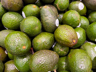 Oklahoma, USA - March 21, 2022: A pile of avocado on the shelf in a supermarket for sale. Oklahoma, USA