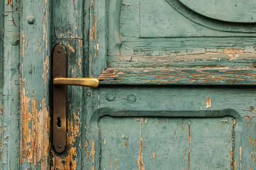 Old mint green door detail with handle